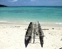 Papua New Guinean Geography - Outrigger canoe on the coast