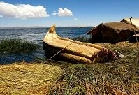 Peruvian Architecture - Reed boat and house on Lake Titicaca